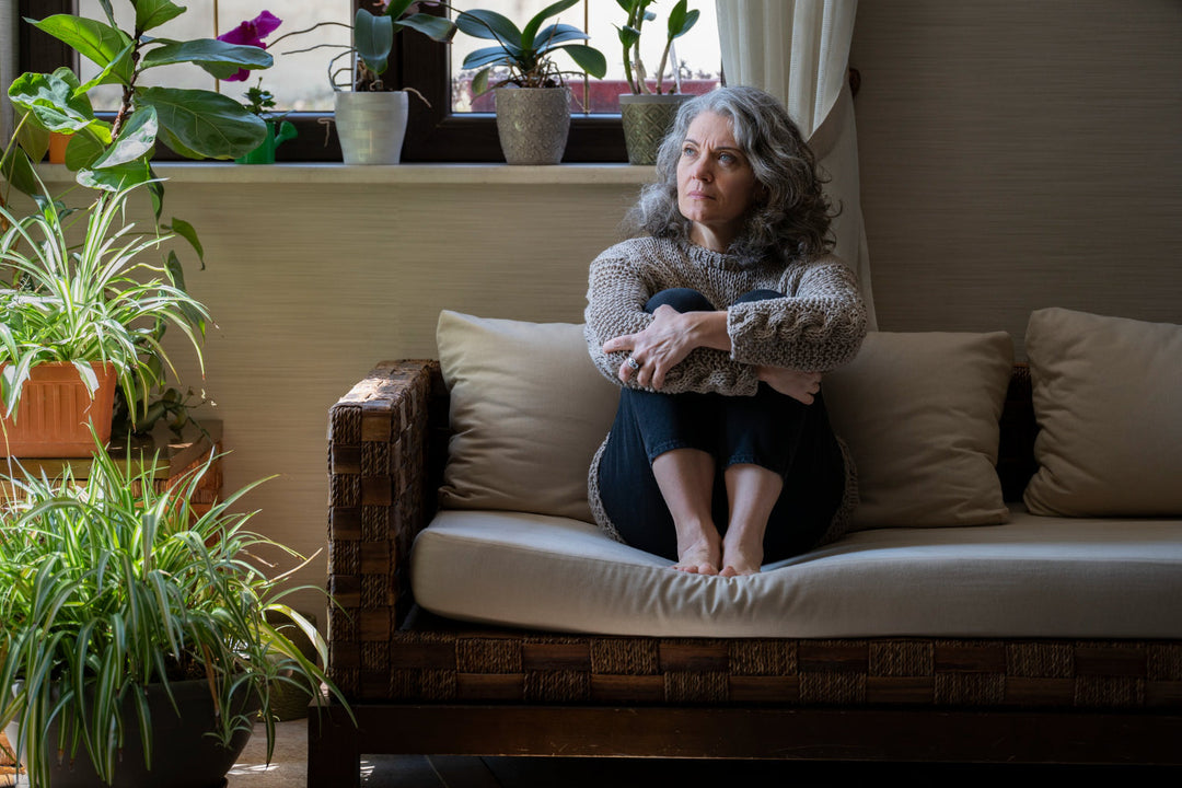 Sad woman on couch