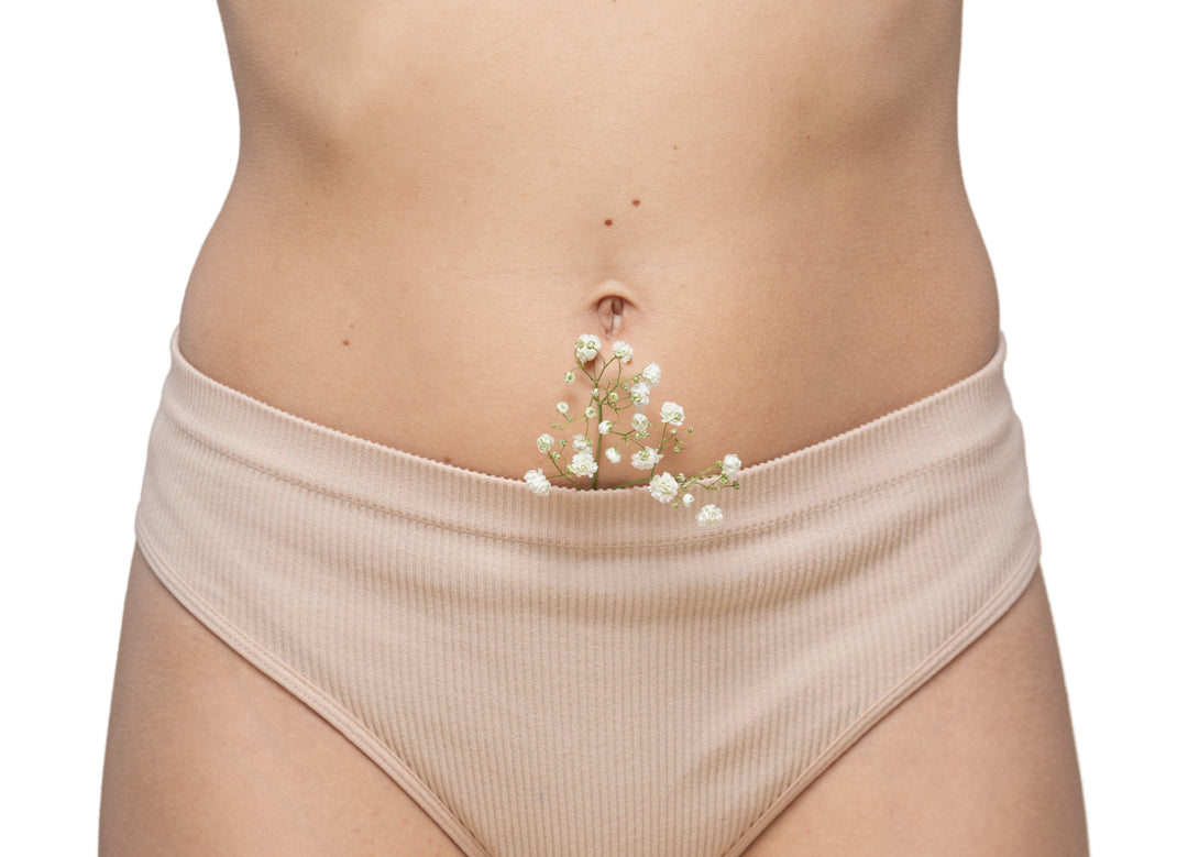 Lower abdomen with flowers symbolizing feminine health